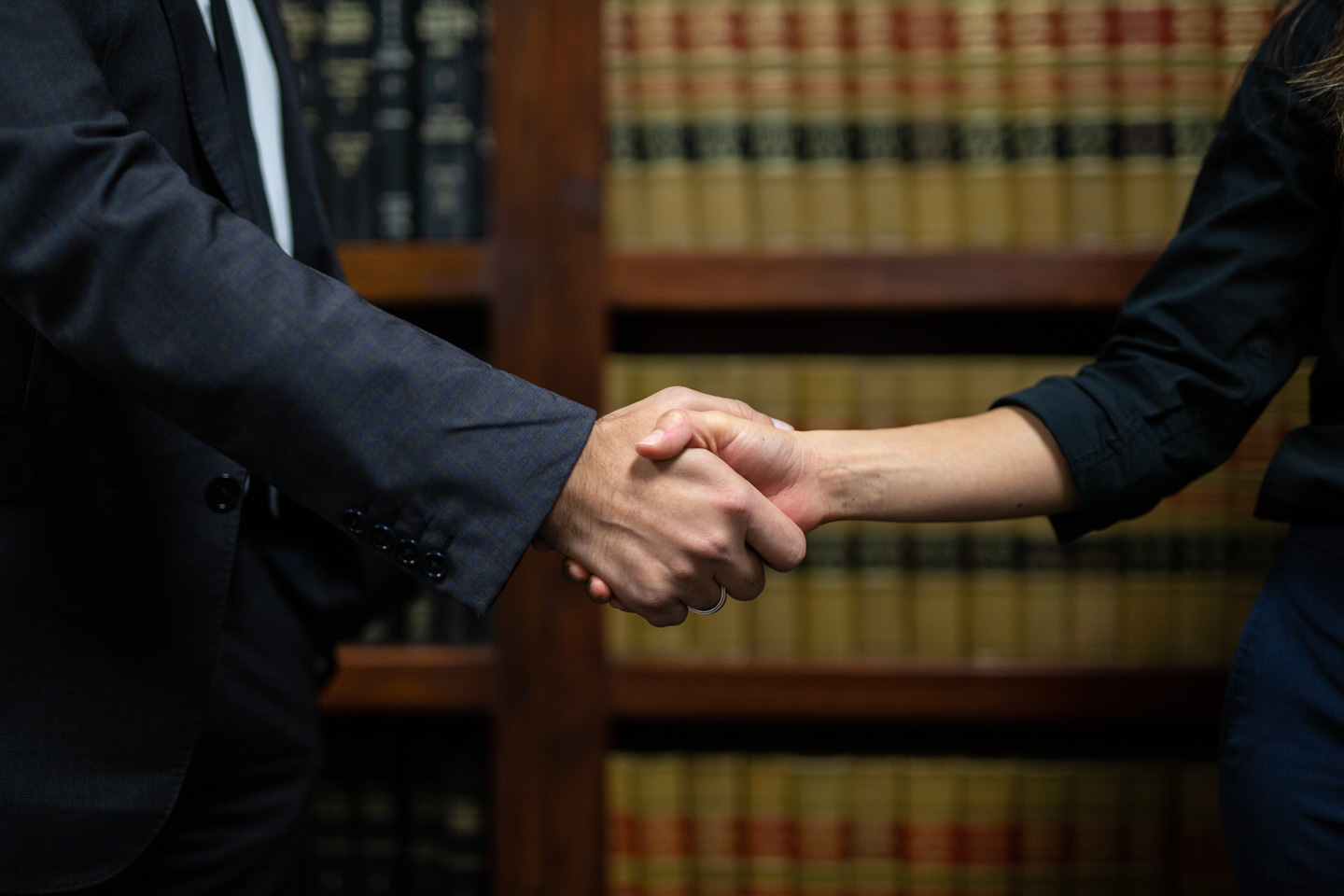 A lawyer and a client shaking hands